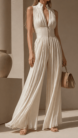 Greta – Mono plisado con cremallera frontal y pantalón palazzo